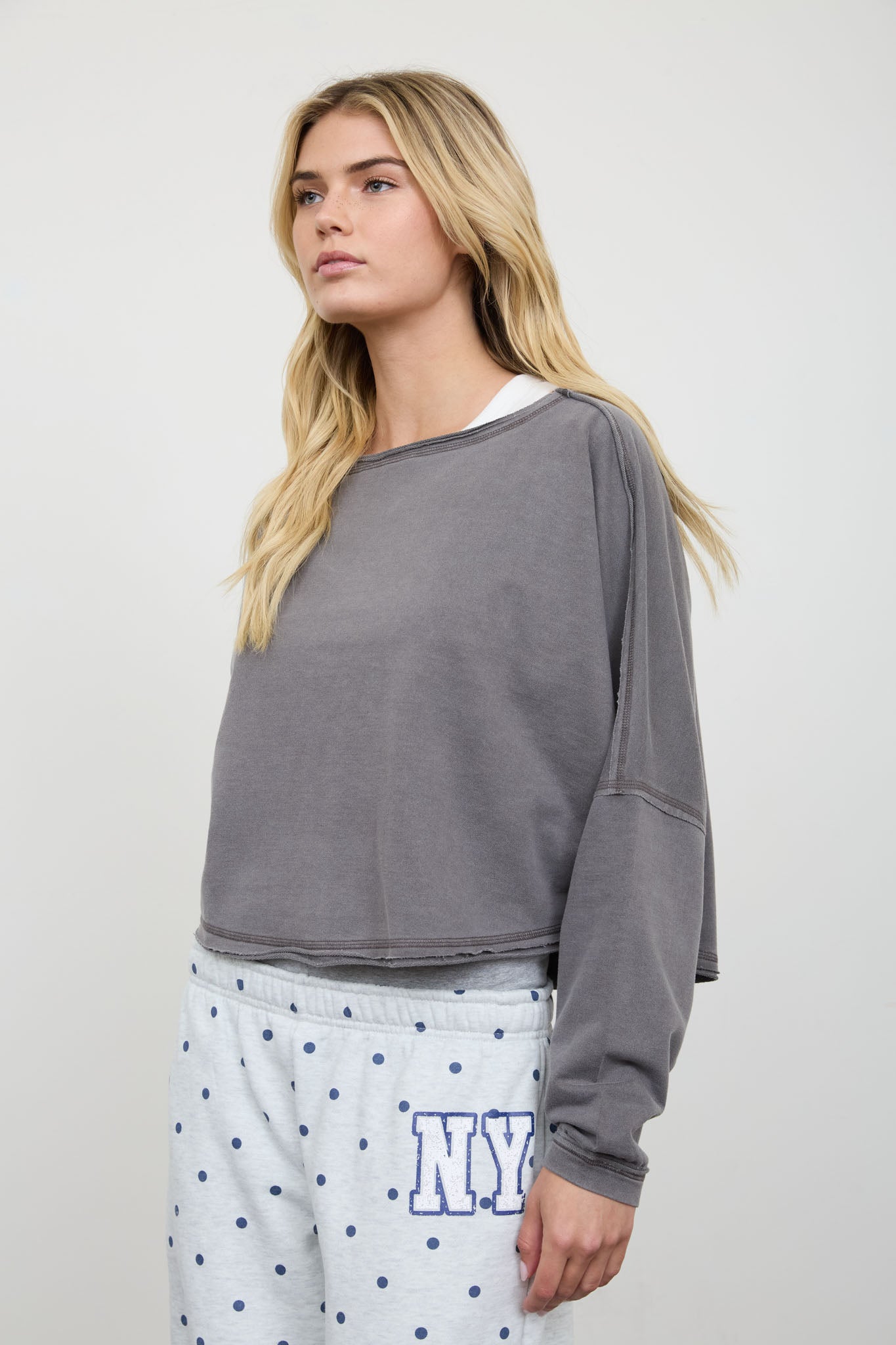 BOAT NECK RAW EDGE LONG SLEEVE CROPPED KNIT TOP