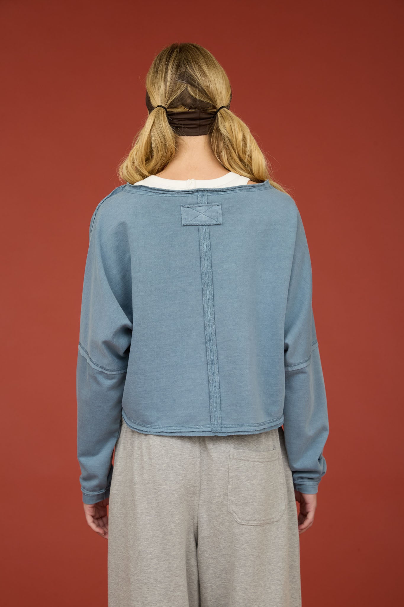 BOAT NECK RAW EDGE LONG SLEEVE CROPPED KNIT TOP