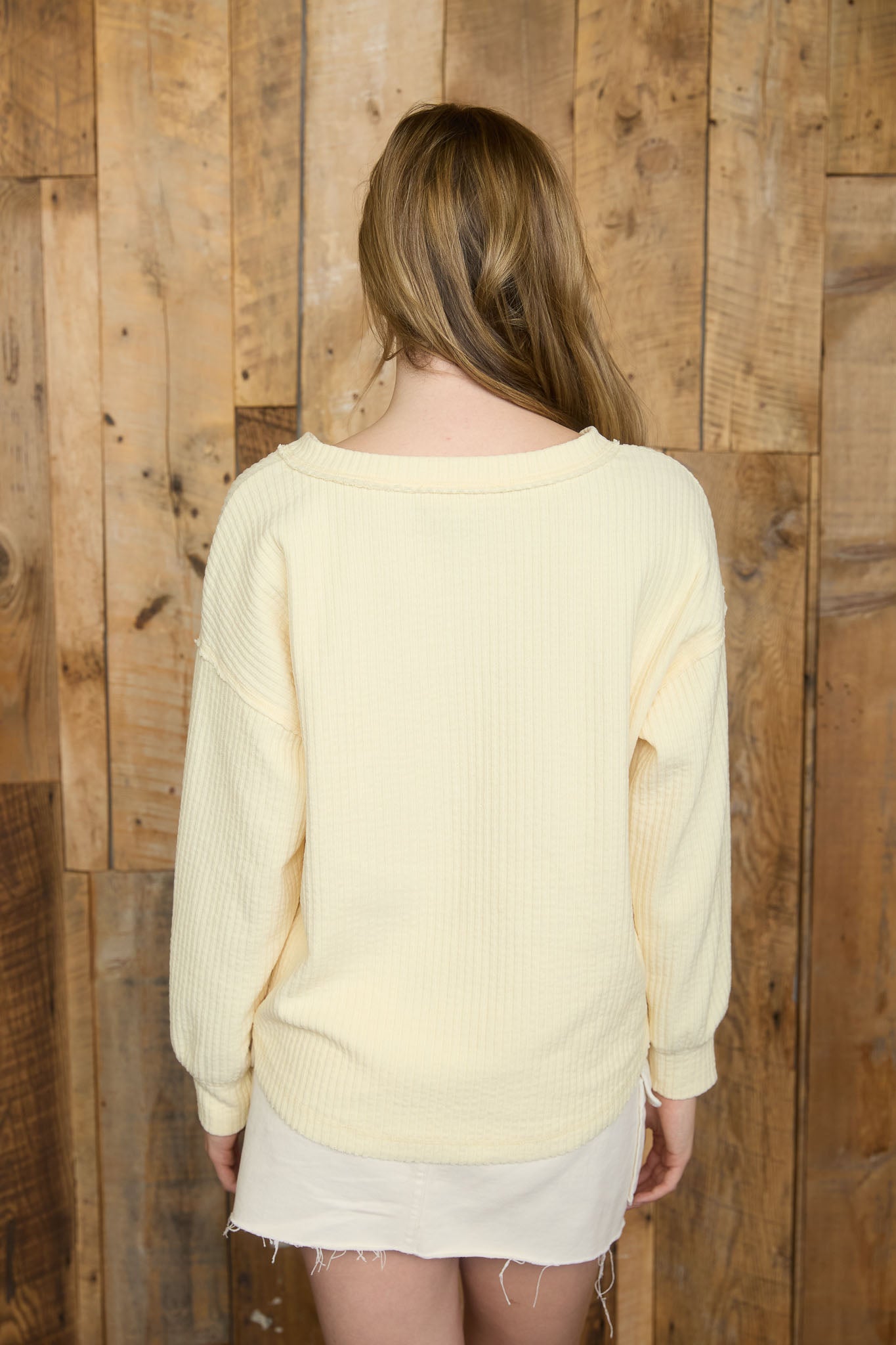 RIBBED HENLEY LONG SLEEVE EXPOSED SEAM KNIT TOP