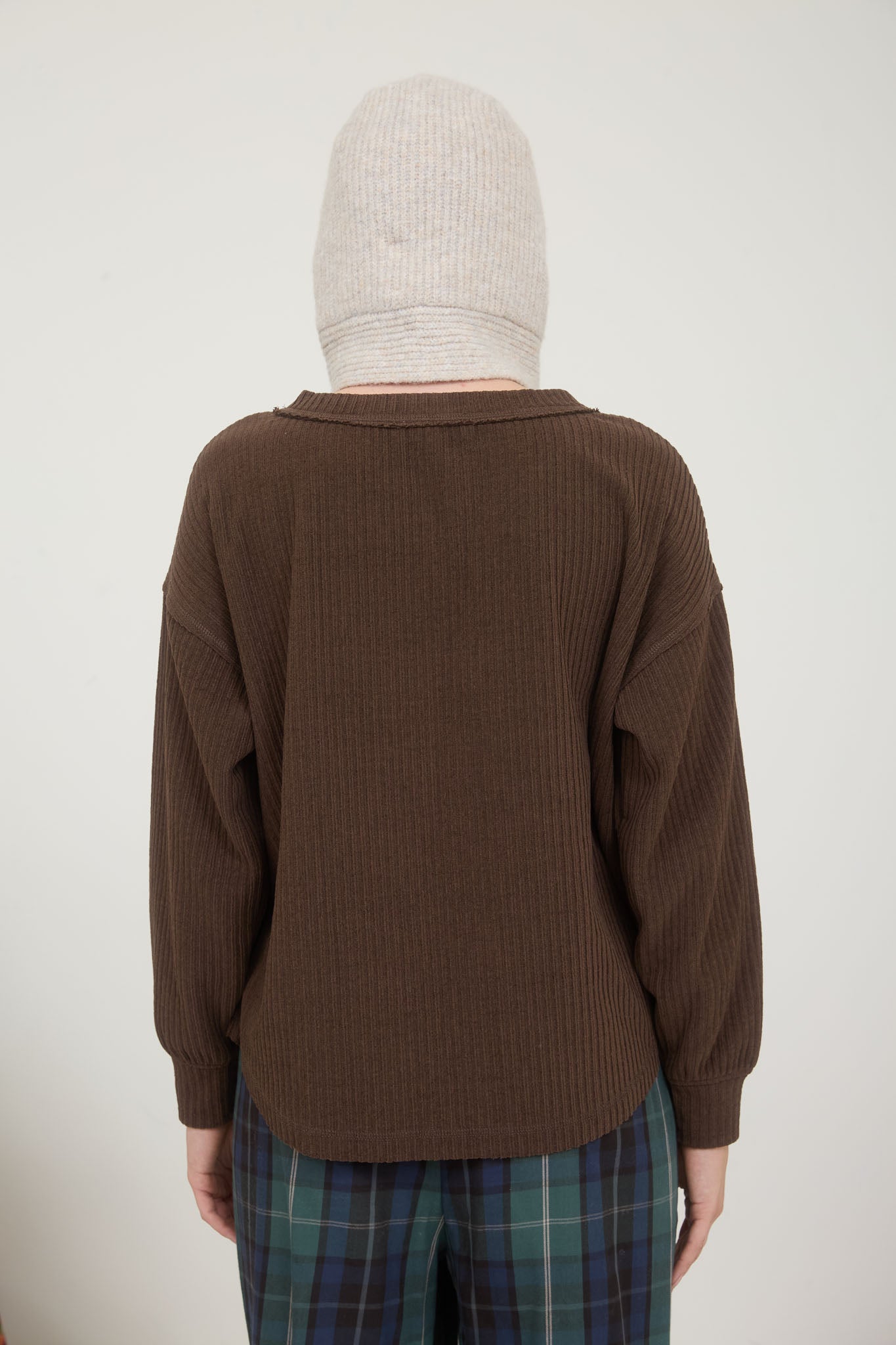 RIBBED HENLEY LONG SLEEVE EXPOSED SEAM KNIT TOP