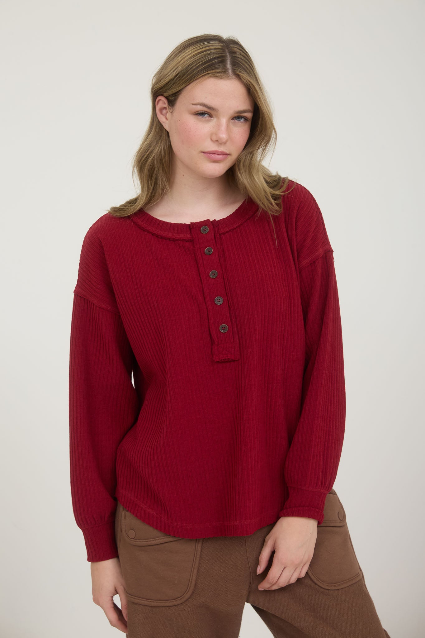 RIBBED HENLEY LONG SLEEVE EXPOSED SEAM KNIT TOP