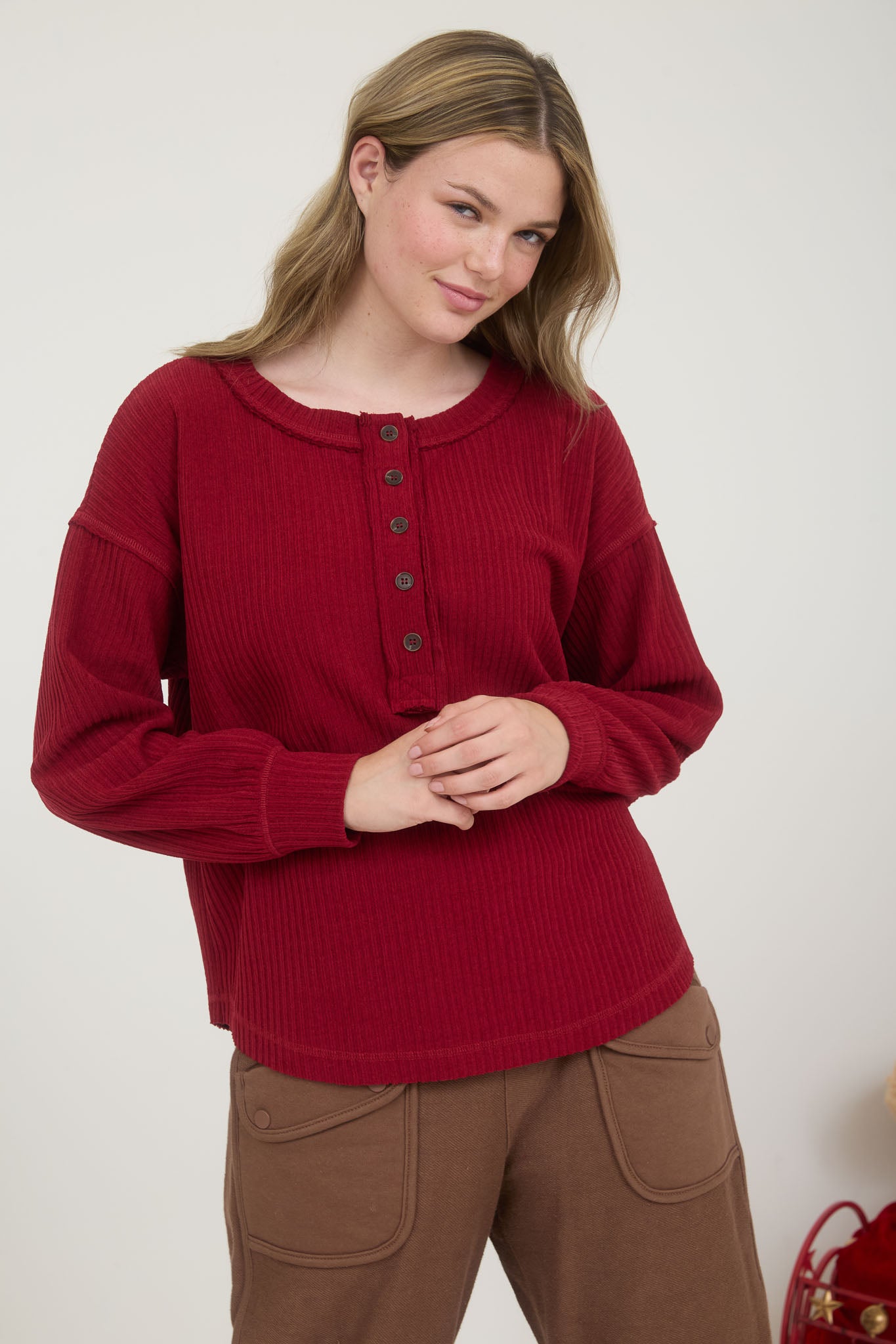 RIBBED HENLEY LONG SLEEVE EXPOSED SEAM KNIT TOP