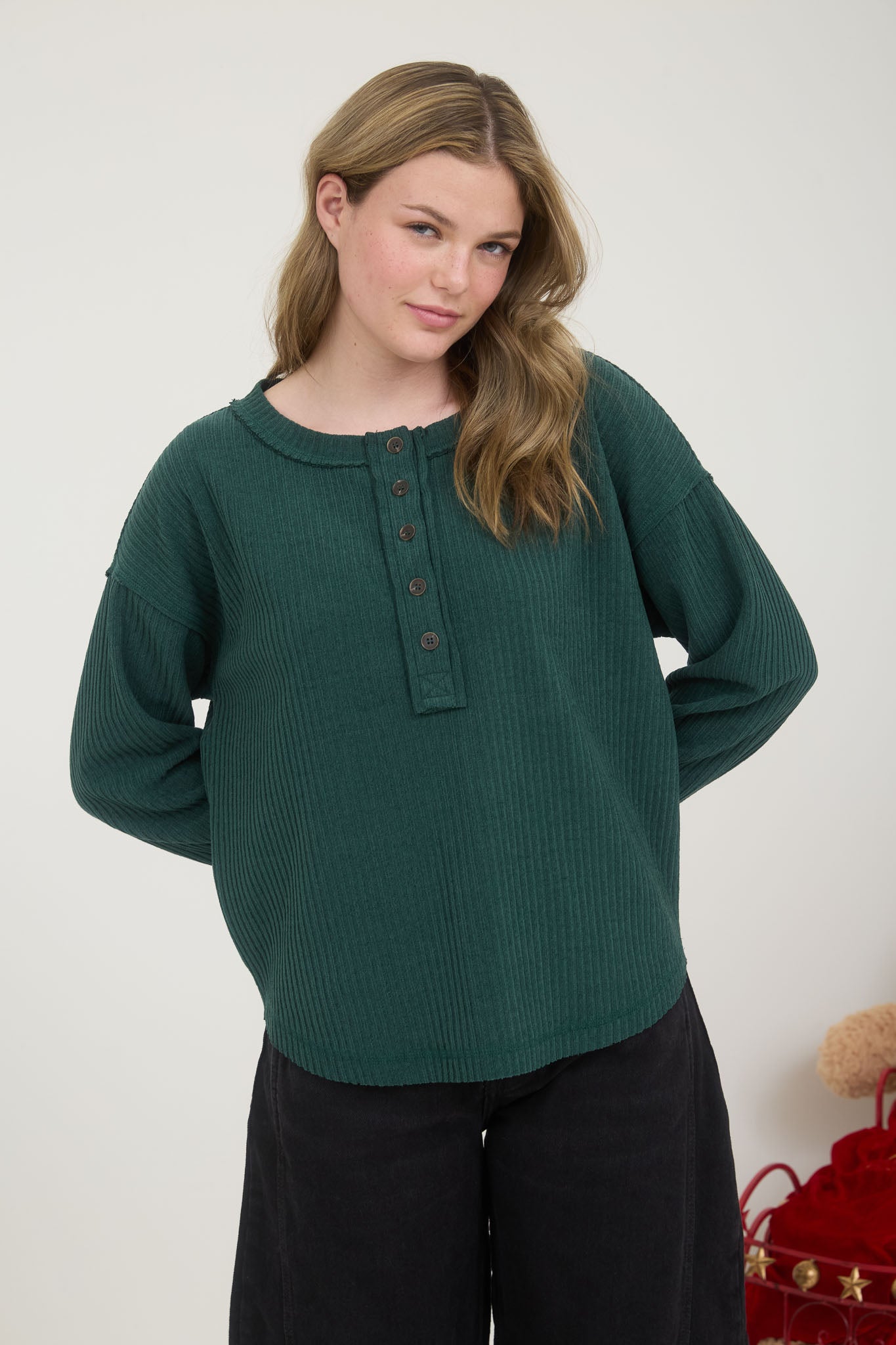 RIBBED HENLEY LONG SLEEVE EXPOSED SEAM KNIT TOP