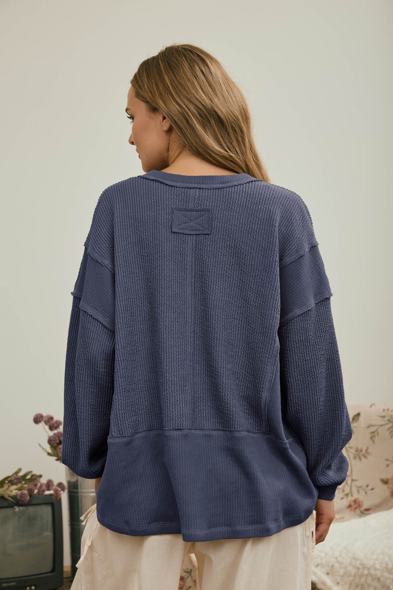 SPLIT NECK RAW EDGE LONG SLEEVE RIBBED KNIT TOP (PRE-ORDER)